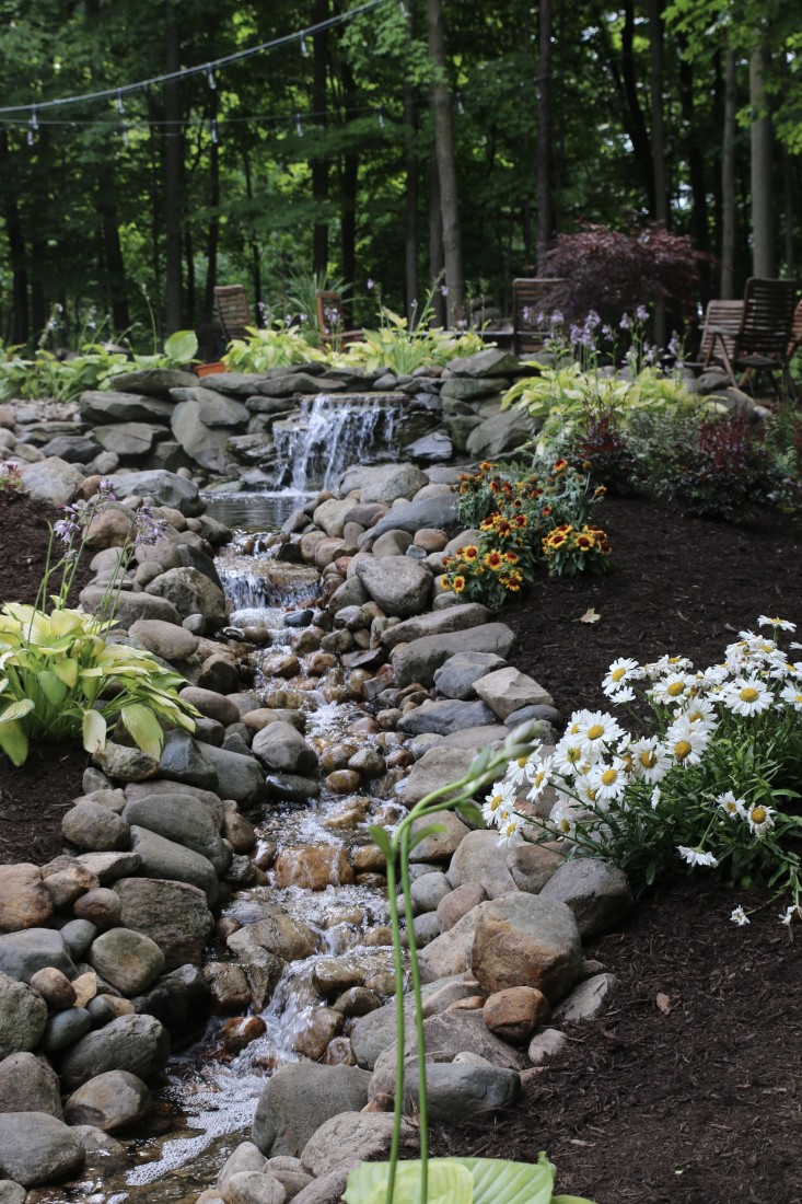 waterfall with natural stone and plants photo